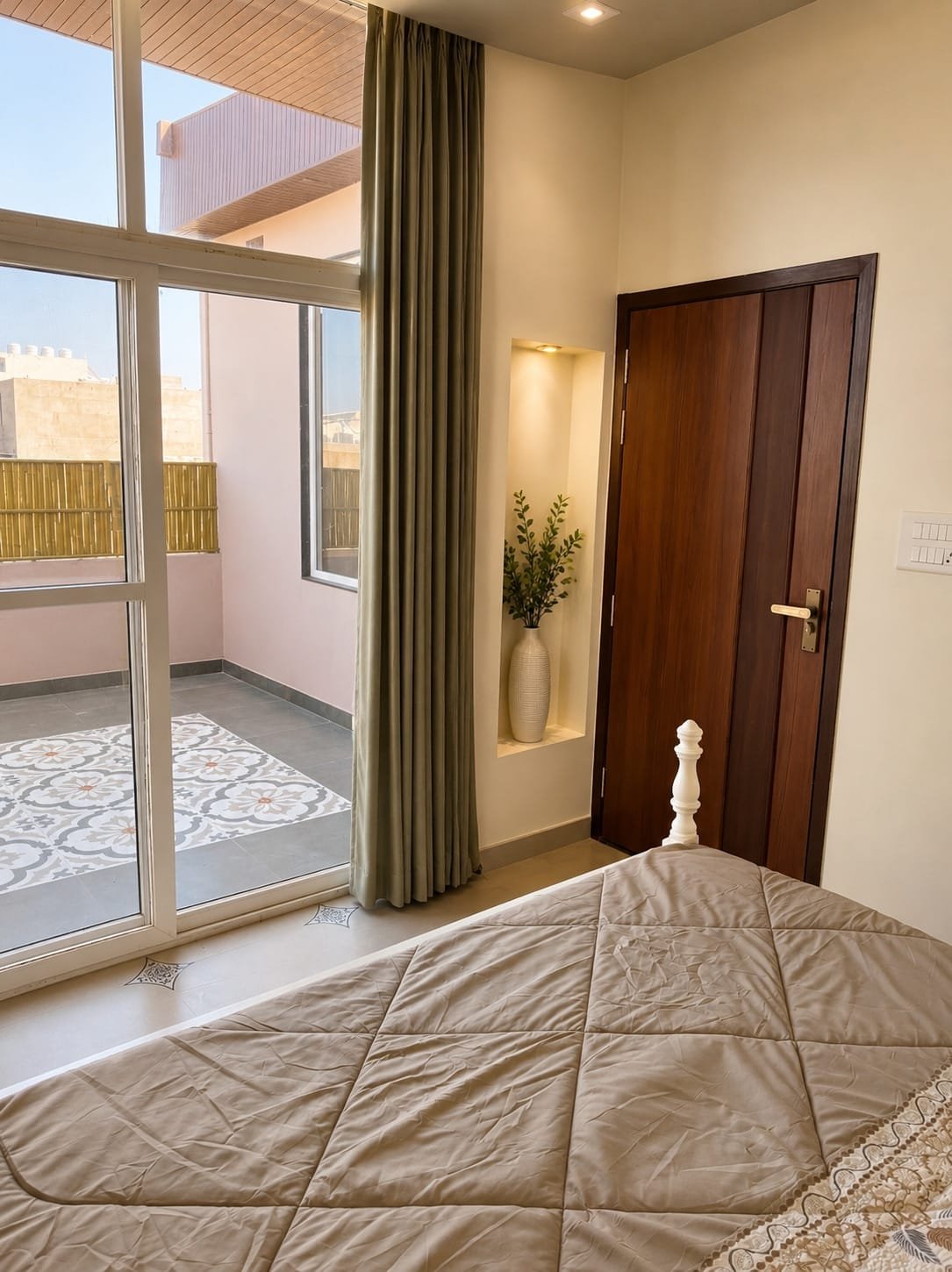 Bedroom 1 with glass doors opening to the terrace