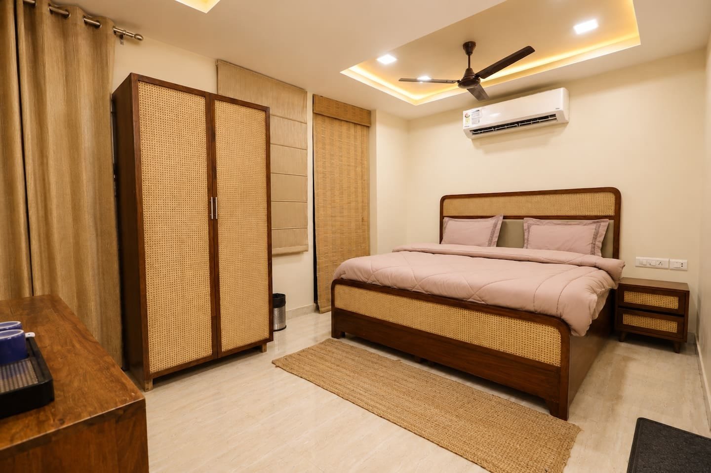 Bedroom 2 with a two-door wardrobe, bed and ceiling fan