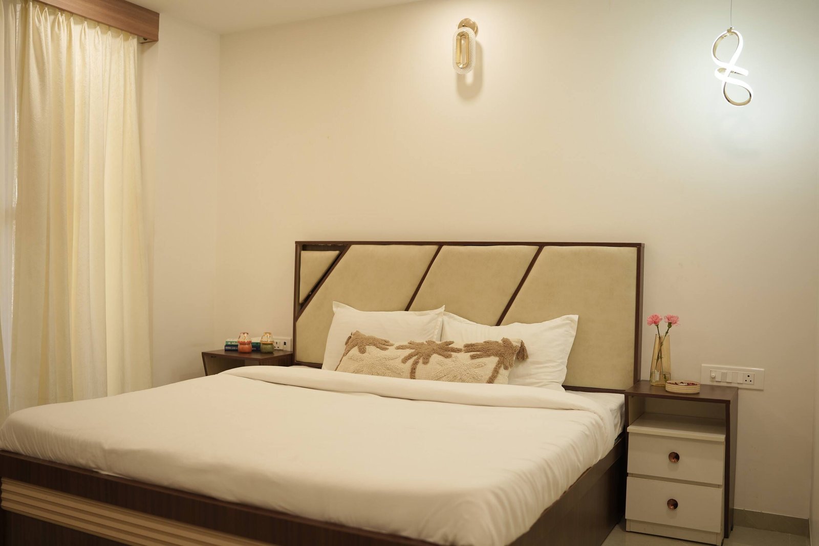 Bedroom 3 with a panelled headboard and white linen